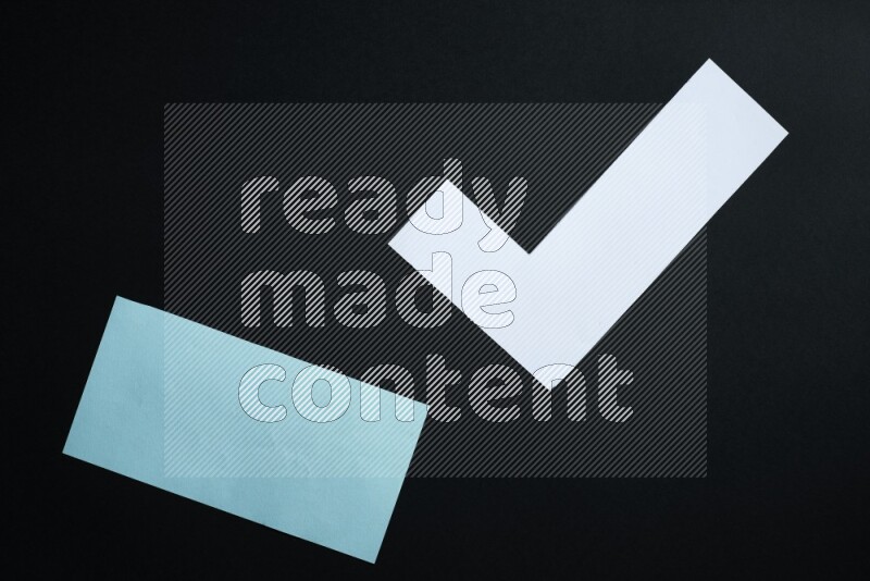 Multicolored paper sheet on black background