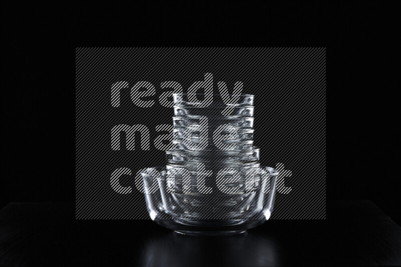 Glassware with rim light against black background