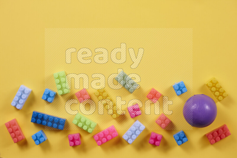 Plastic building blocks with balls on different colored background (kids toys)