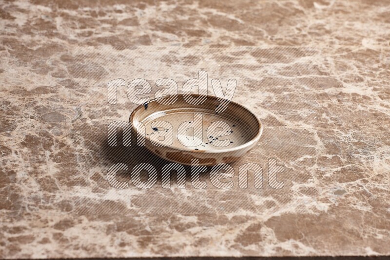 Multicolored Pottery Bowl on Beige Marble Flooring