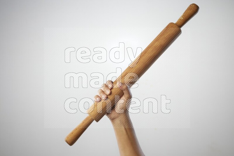 Male Hand Holding Rolling Pin on white background