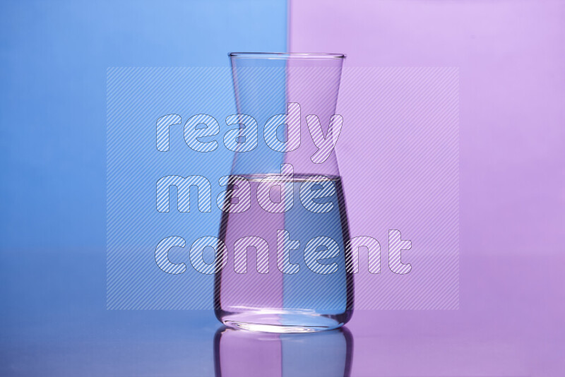 The image features a clear glassware filled with water, set against blue and light purple background