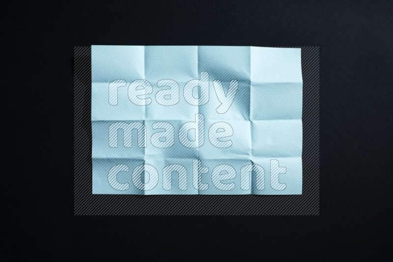 Blue paper sheet on black background