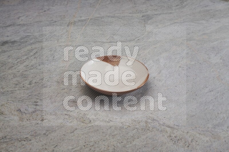 Multicolored Pottery Plate On Grey Marble Flooring