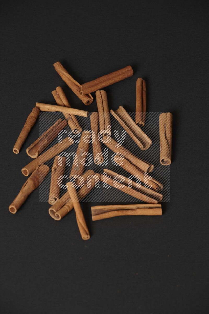 Cinnamon sticks on black background