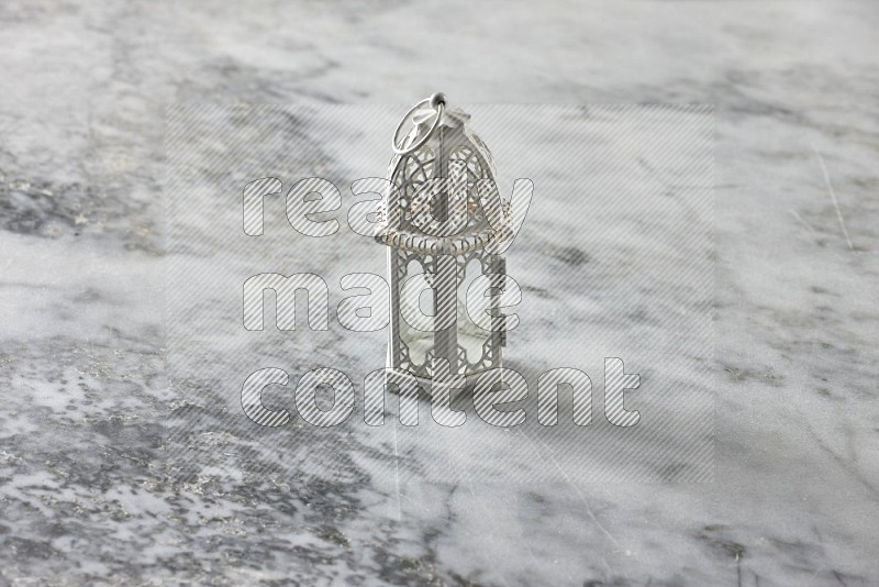 A lantern on grey marble background