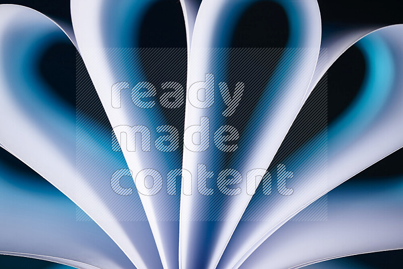 An abstract art piece displaying smooth curves in white and blue gradients created by colored light