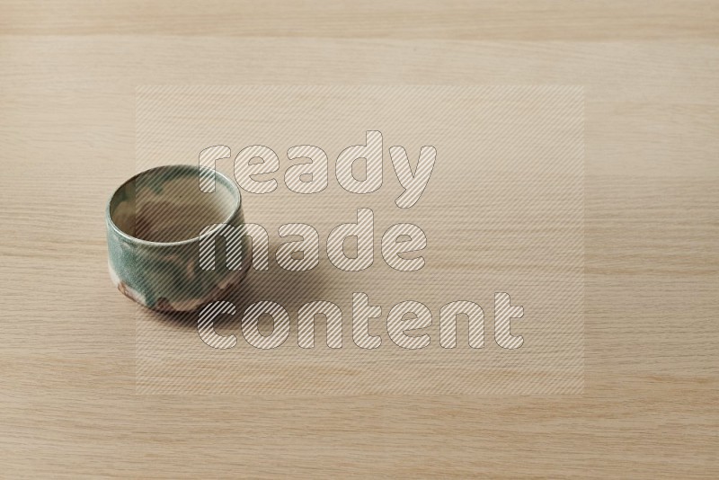 Multicolored Pottery Bowl on Oak Wooden Flooring, 45 degrees