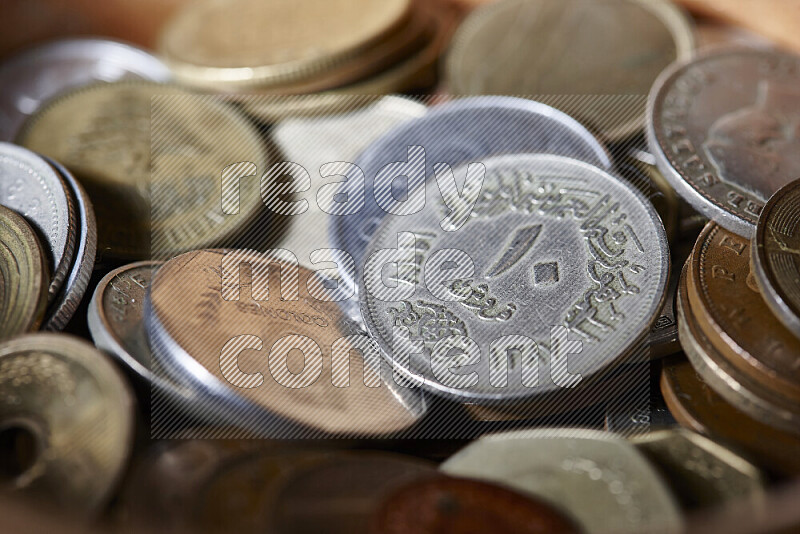 A close-ups of random old coins on black background