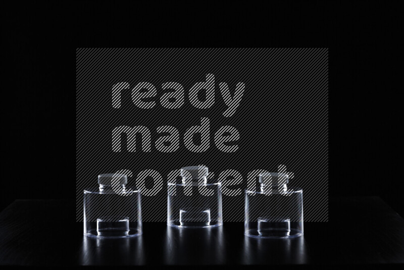 Glassware with rim light against black background