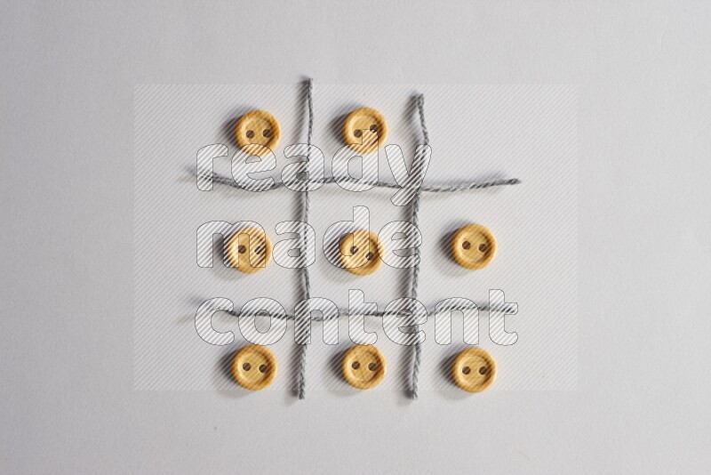 Wooden buttons placed on grey background