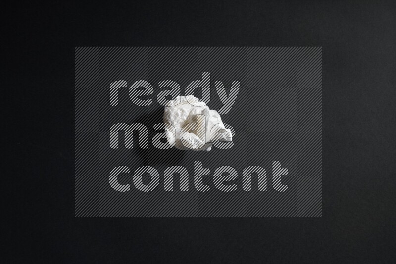 White paper sheet on black background