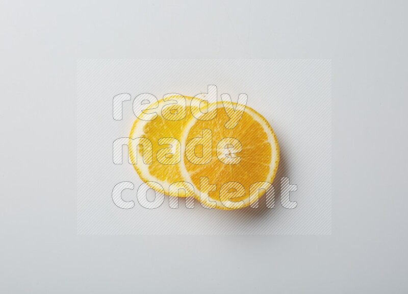 Two orange slices on white background