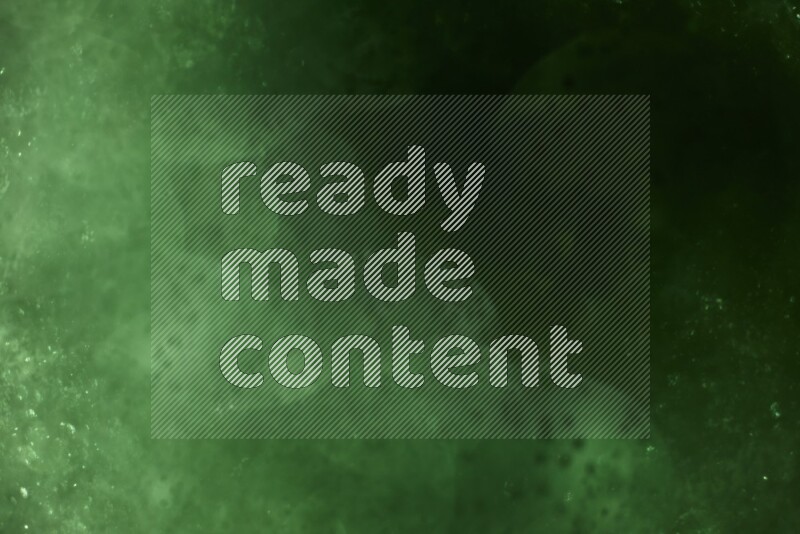 Green glitter powder isolated on black background