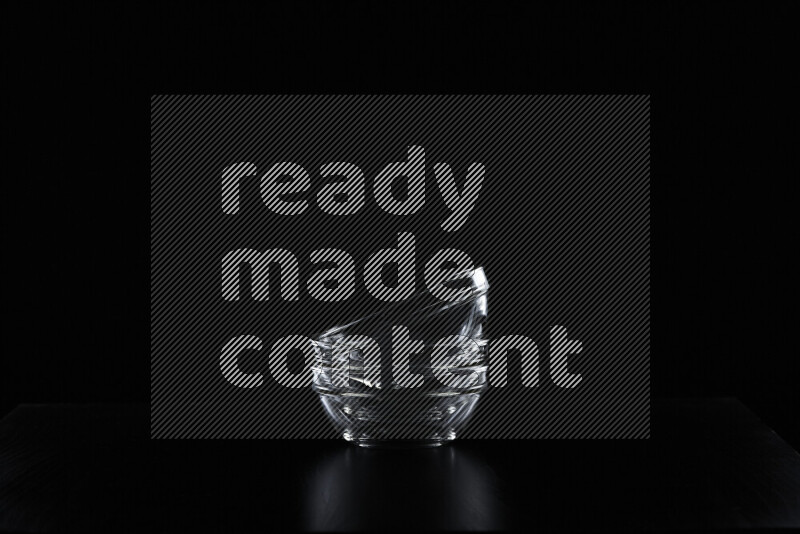 Glassware with rim light against black background