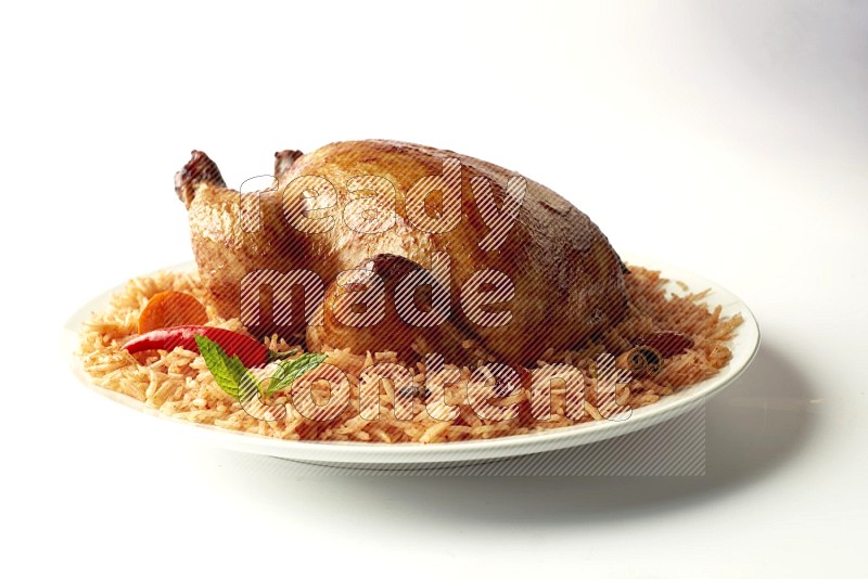 red basmati Rice with  whole roasted chicken on a white rounded plate  direct  on white background