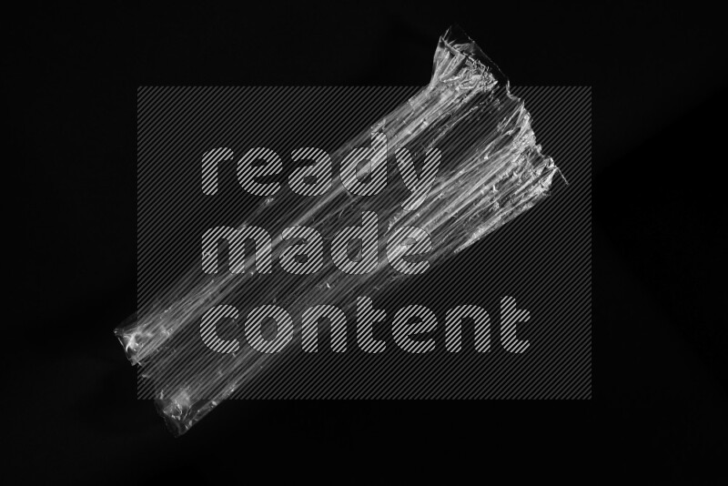 Transparent plastic textures on black background