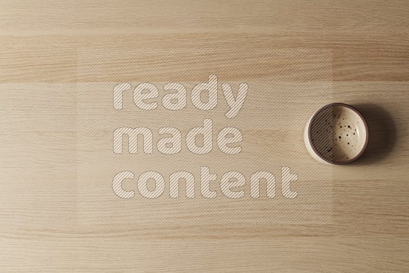 Top View Shot Of A Multicolored Pottery Oven Plate on Oak Wooden Flooring