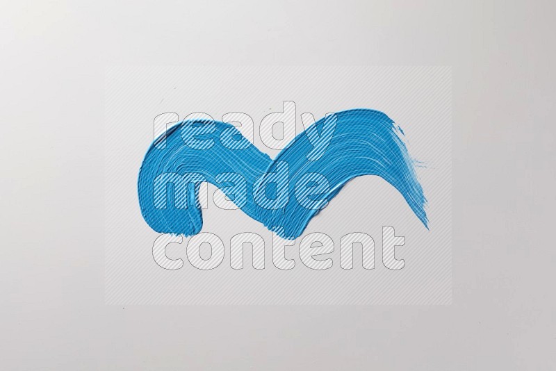 A single blue zigzag brush stroke on a white background