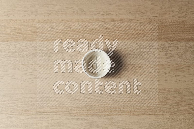 Top View Shot Of A White Pottery Bowl on Oak Wooden Flooring