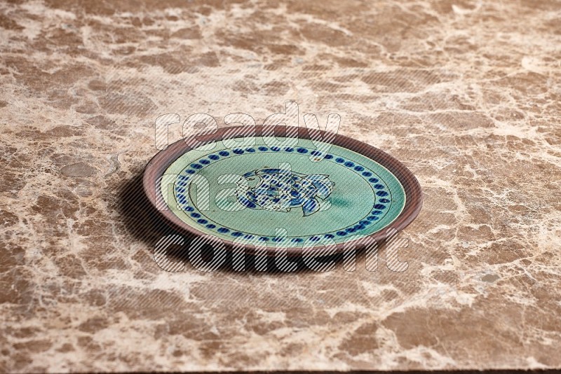 Decorative Pottery Plate on Beige Marble Flooring