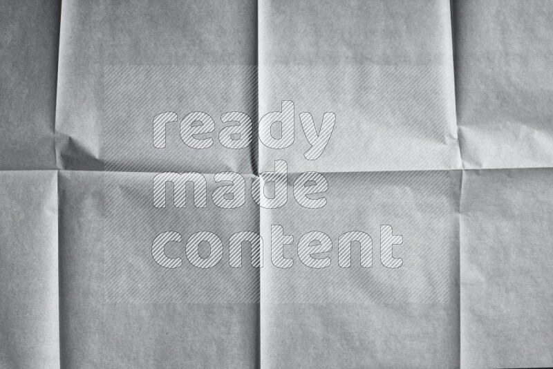 White paper sheet on black background