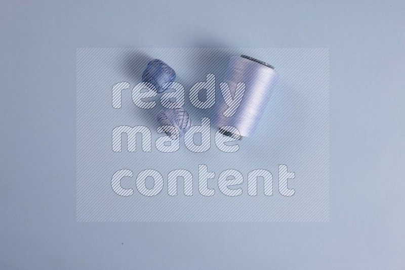 Blue sewing supplies on blue background