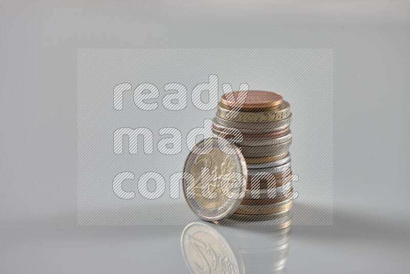 Random old coins on grey background