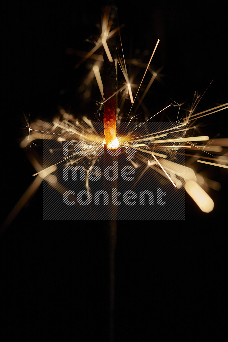 A close-up image of sparkler candle isolated on black background