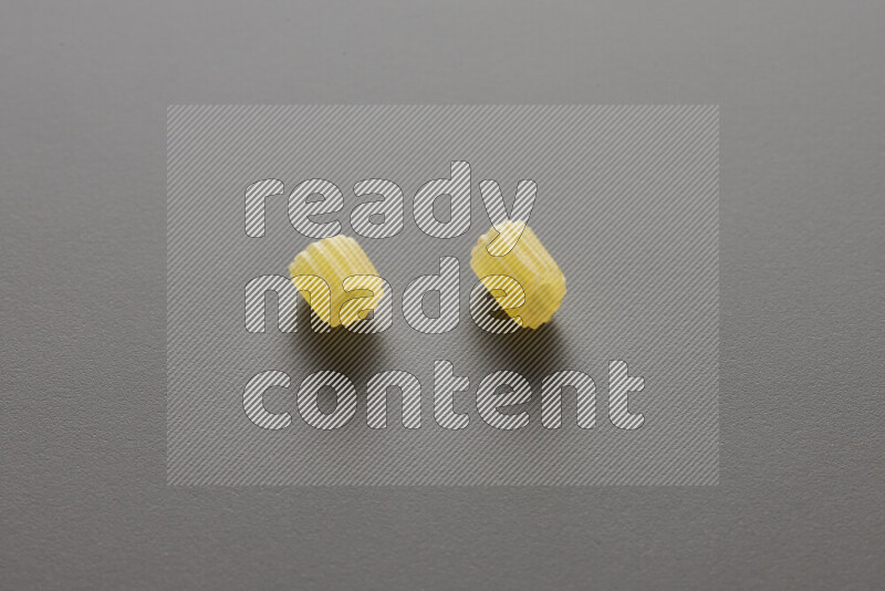 Small rings pasta on grey background