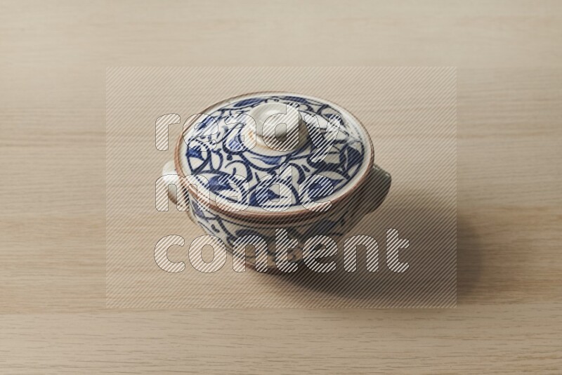 Multicolored Pottery Pot on Oak Wooden Flooring, 45 degrees