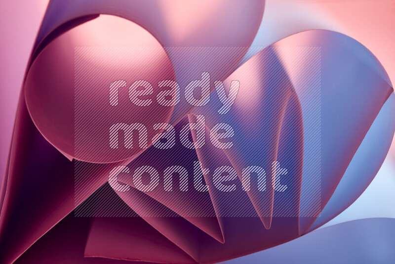 An artistic display of paper folds creating a harmonious blend of geometric shapes, highlighted by soft lighting in purple tones