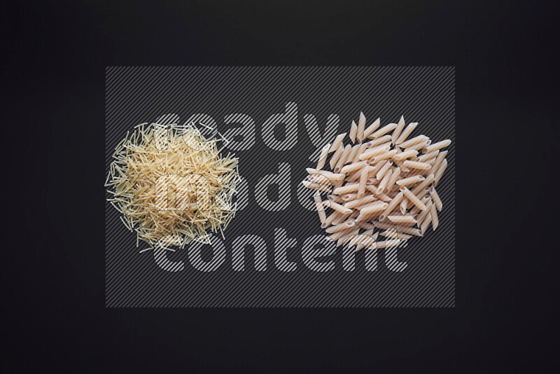 Different pasta types in bunches on black background