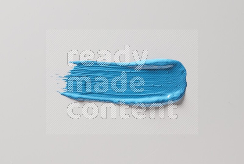 A single blue straight line brush stroke on a white background