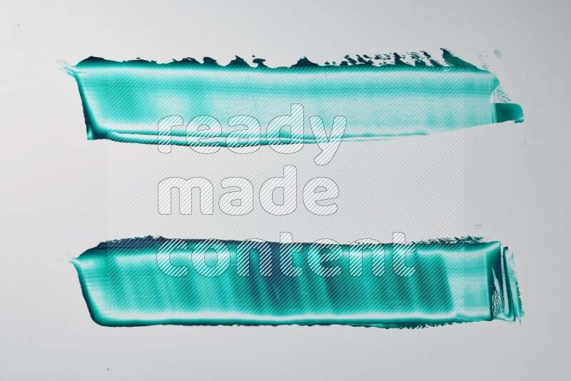 Turquoise painting knife strokes on white background