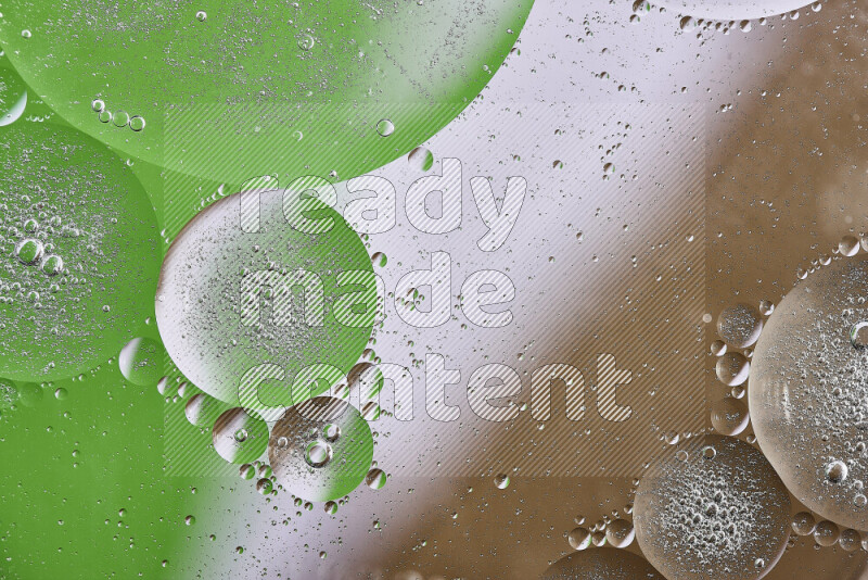 Close-ups of abstract oil bubbles on water surface in shades of brown, green and white