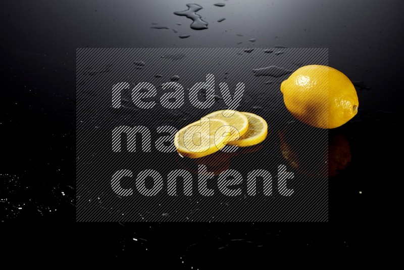 Lemon slices with water drops, and droplets on black background