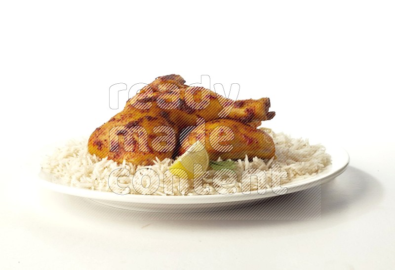 white  basmati Rice with  kabsa chicken pieces  on a white rounded plate direct on white background