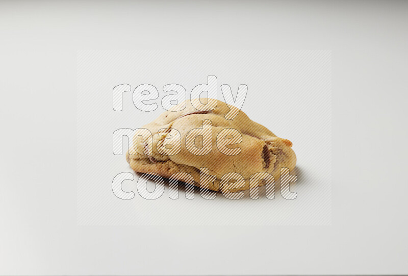 a chocolate chip cookie on a white background