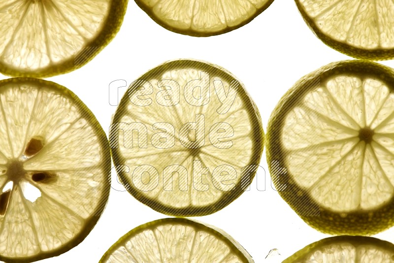 Lemon slices on illuminated white background