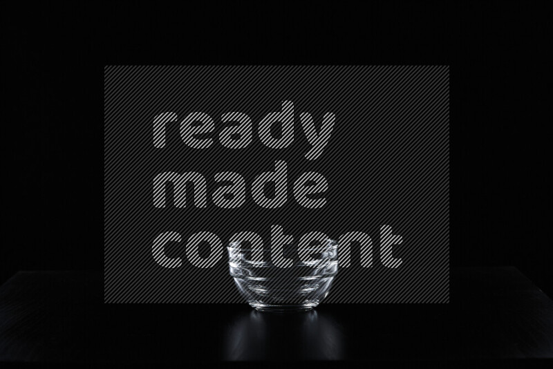 Glassware with rim light against black background