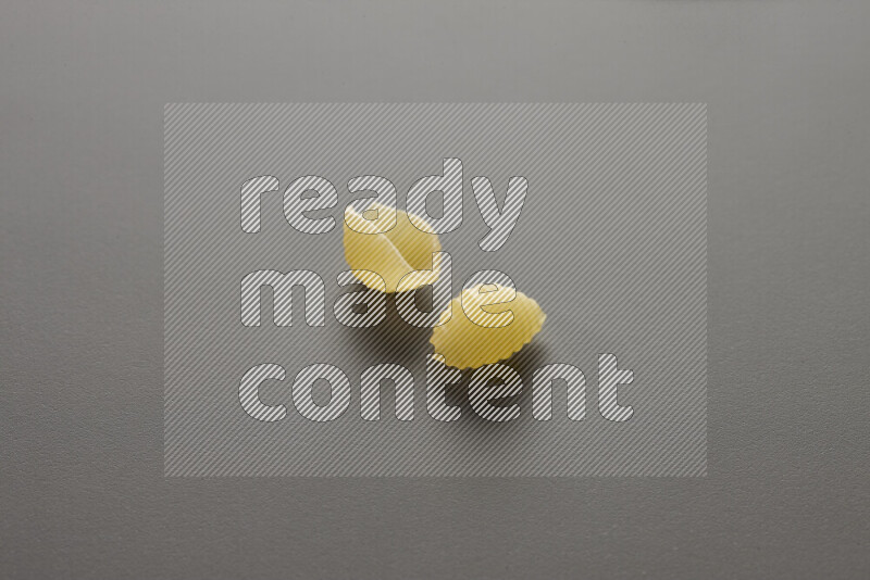 Shells pasta on grey background