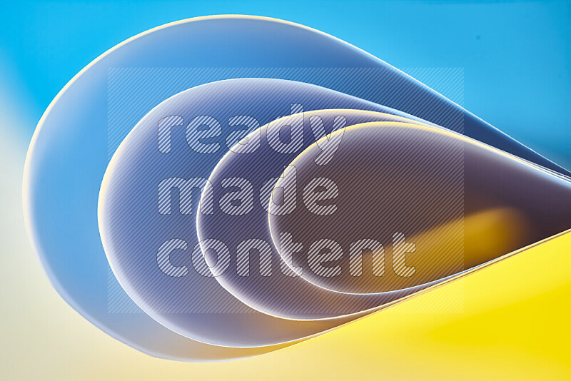 An abstract art of paper folded into smooth curves in blue and yellow gradients