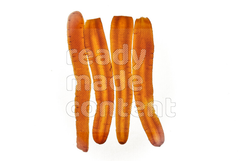 Carrots slices on illuminated white background