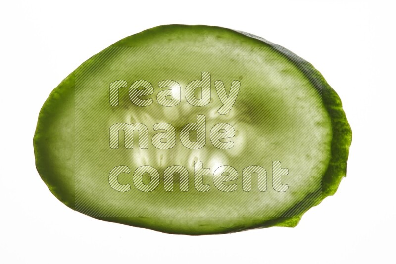 Cucumber slices on illuminated white background