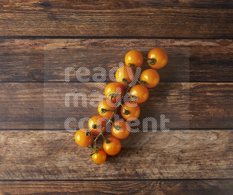 Single cherry tomato vein topview on a wooden background