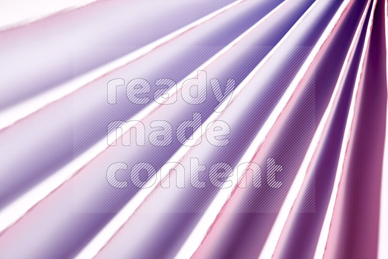 An image presenting an abstract paper pattern of lines in white and purple tones