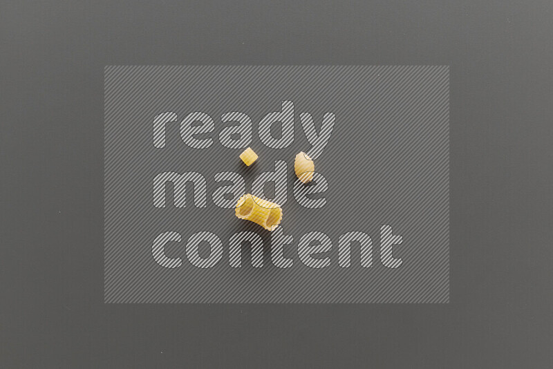 Different pasta types on grey background