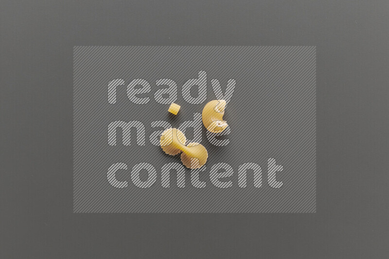 Different pasta types on grey background