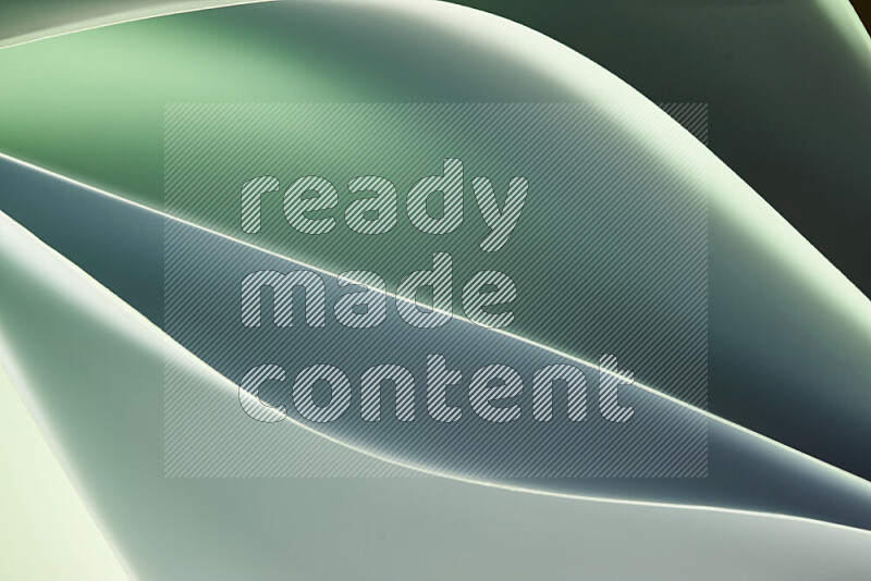 This image showcases an abstract paper art composition with paper curves in green gradients created by colored light